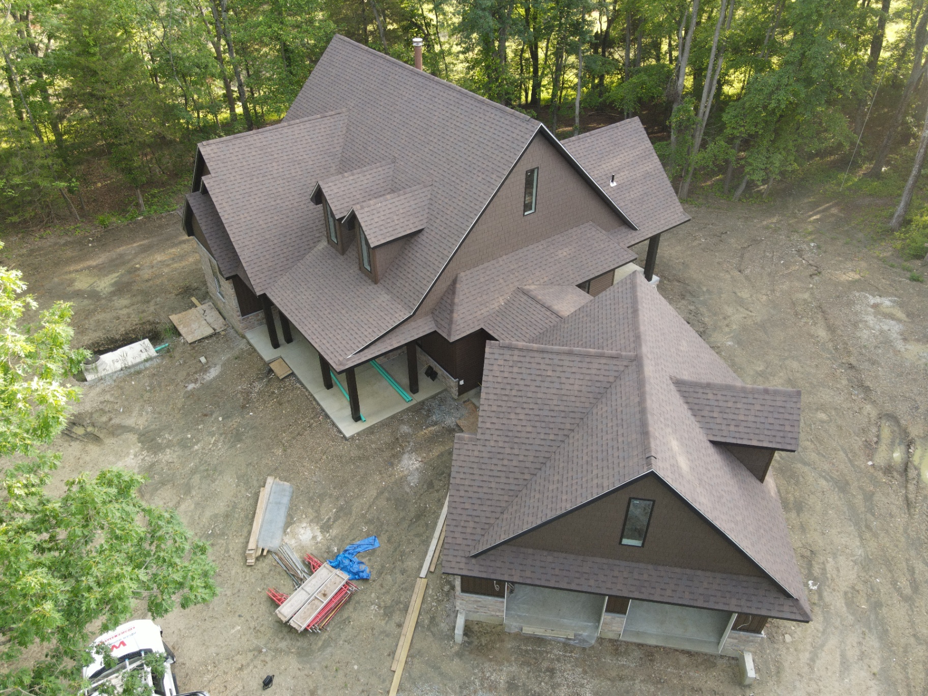Completed brown architectural shingle roof on a custom home