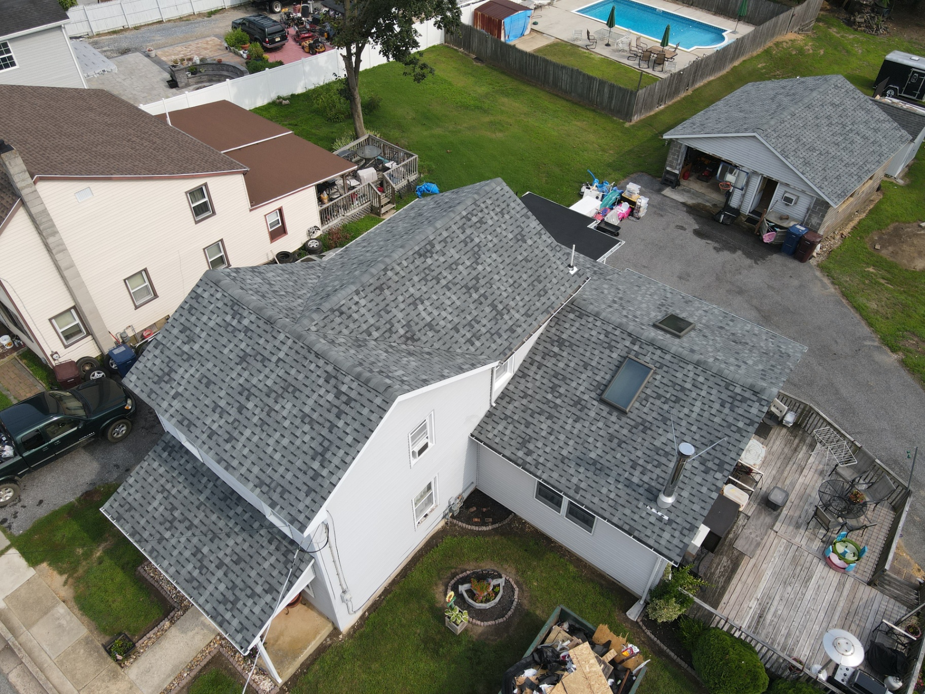 Finished roofing system on a multi-section home viewed from above