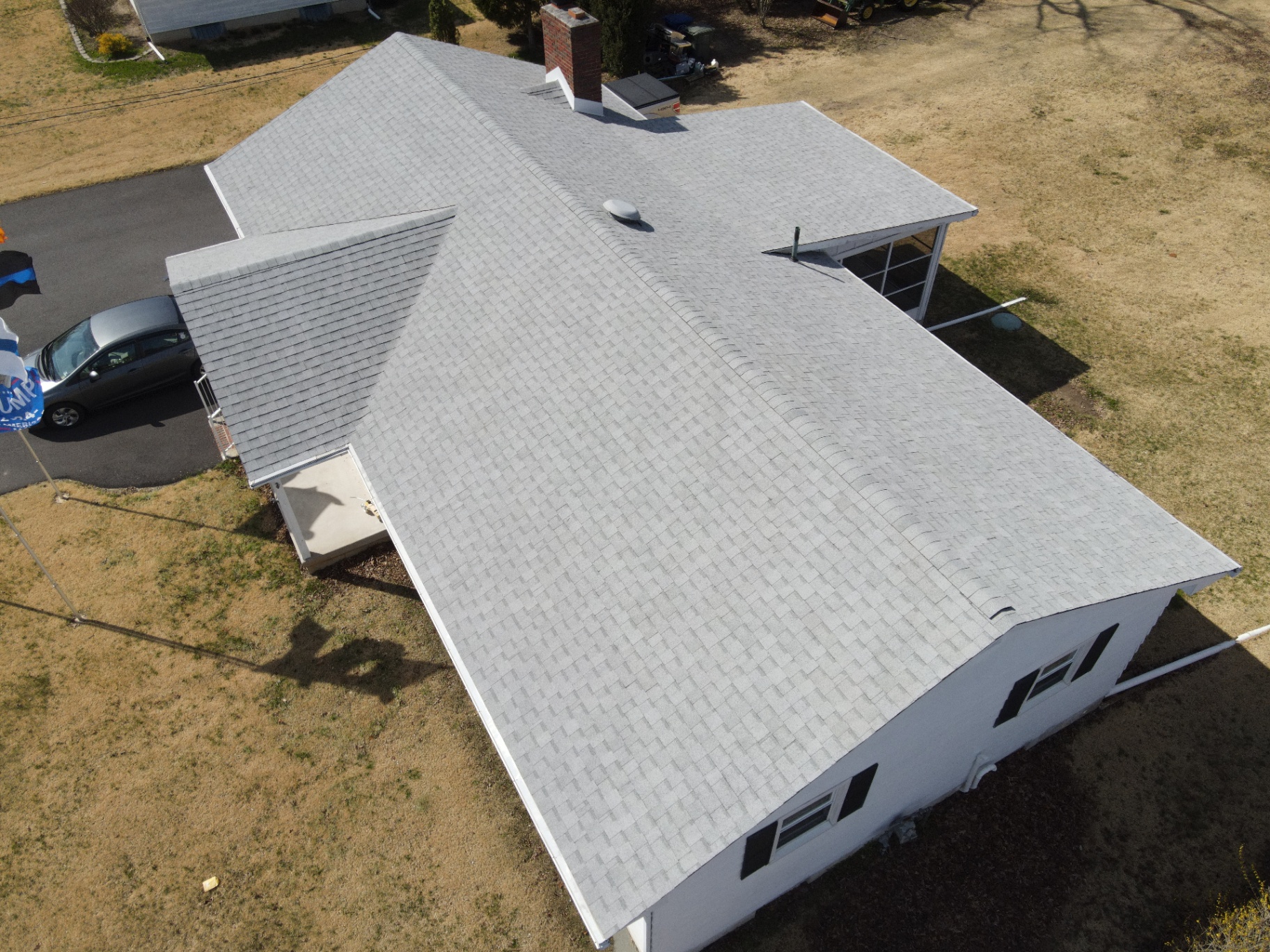 Finished pale-gray shingle roof on a single-story home