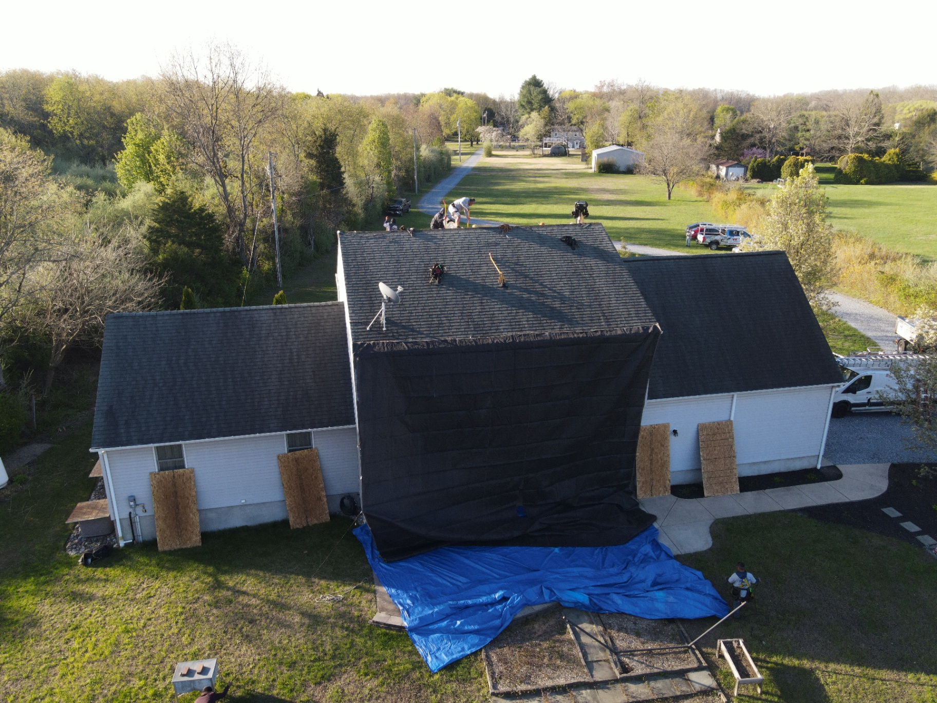 Residential roof protected during installation on a large home