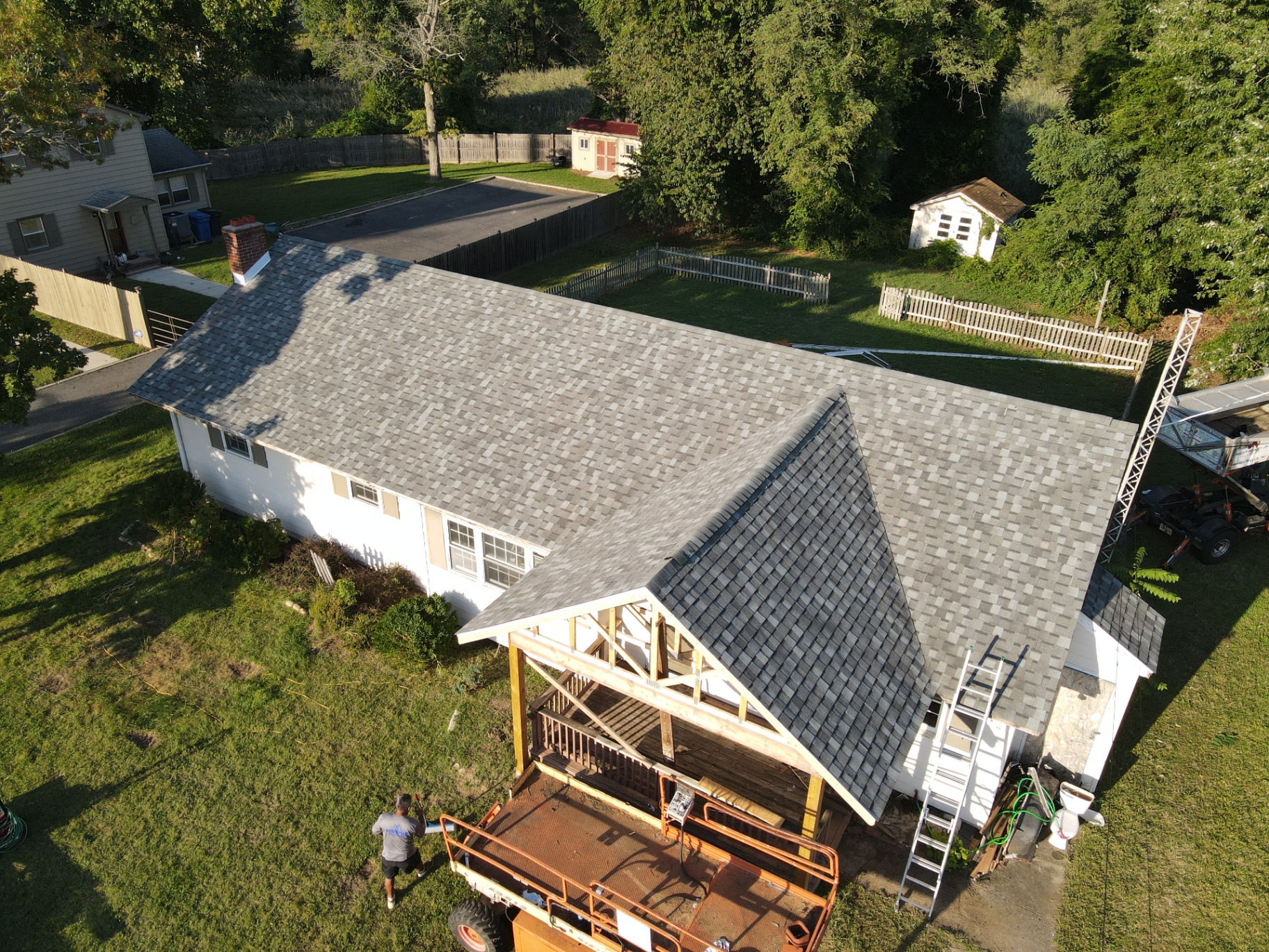 New light-gray architectural shingle roof on a residential home addition